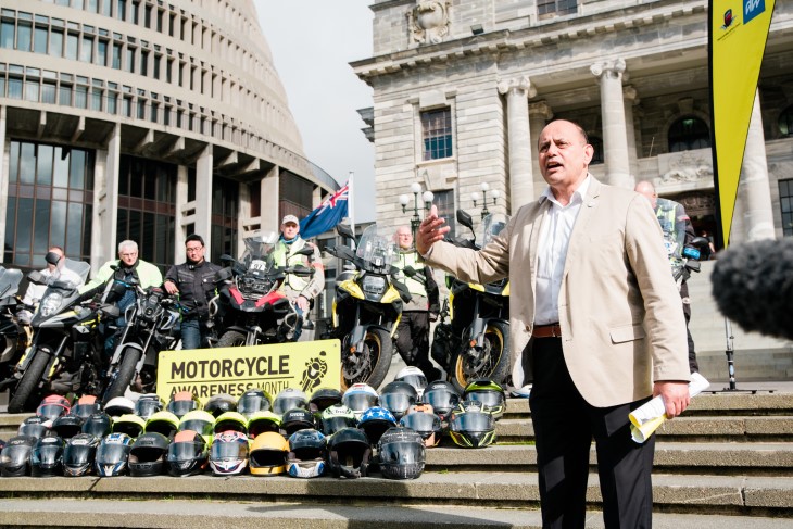 Hon. Willie Jackson addresses the launch event on the steps of Parliament, in front of 41 helmets to