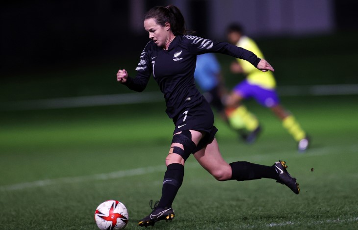 Liv Chance goes to kick a football during a match