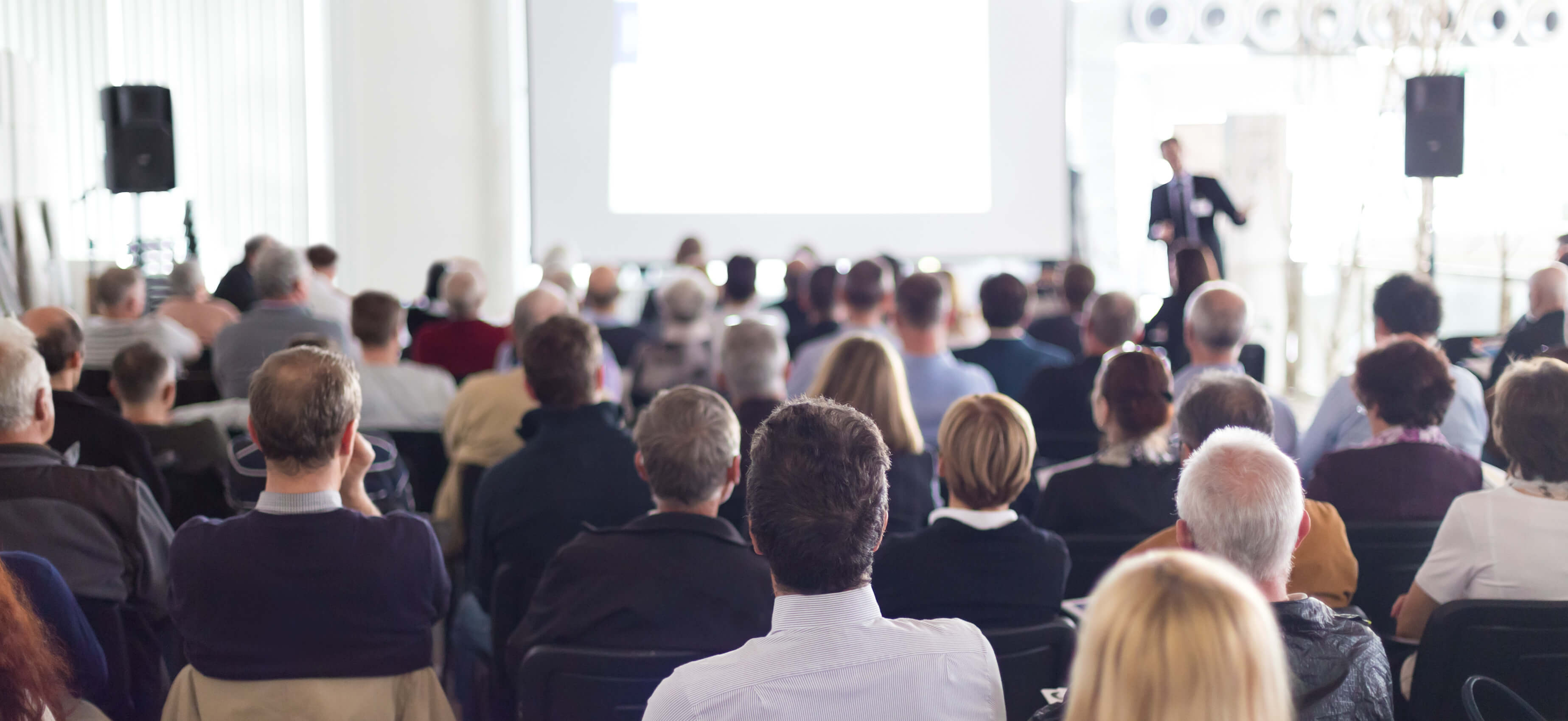 Man speaking at conference v2