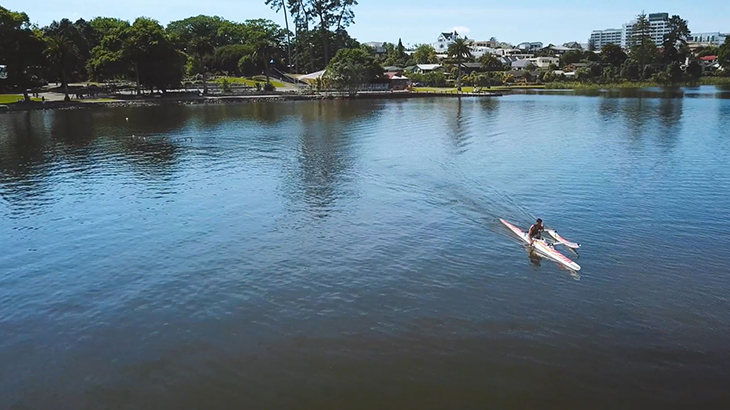 Peter Cowan paddling his outrigger canoe on Lake Rotoroa in Hamilton.