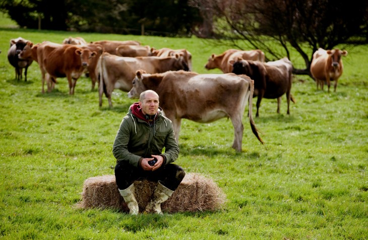 Hamish Bennett sits on a farm