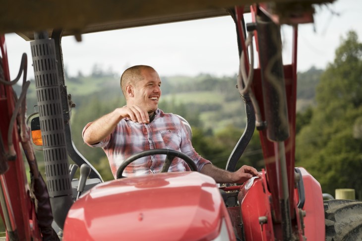 Hamish Bennett rides a tractor during filming