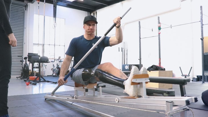 Corbin Hart trains on the paddling machine