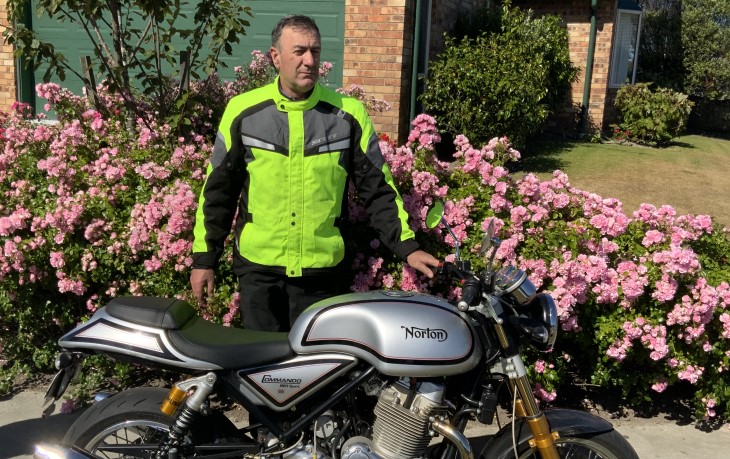 Motorcyclist Davitt Lavery stands beside his bike. 