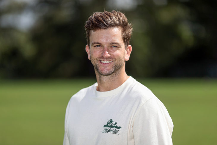 Josh Margetts poses for a photo on the pitch