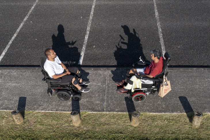 Lee and Wayne have a chat in their wheelchairs