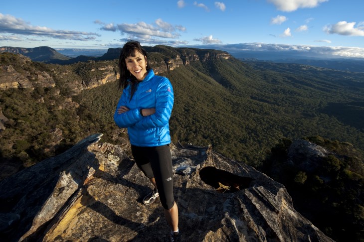 Lisa Tamati stands atop a cliff