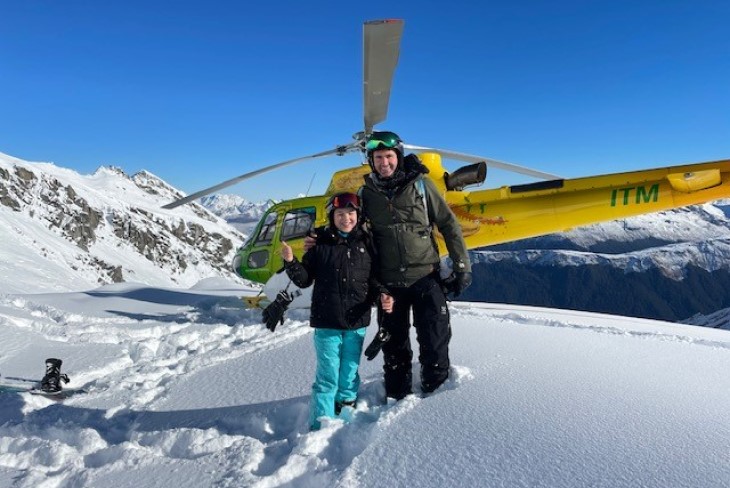 Luke Henley poses with a young person up the mountain