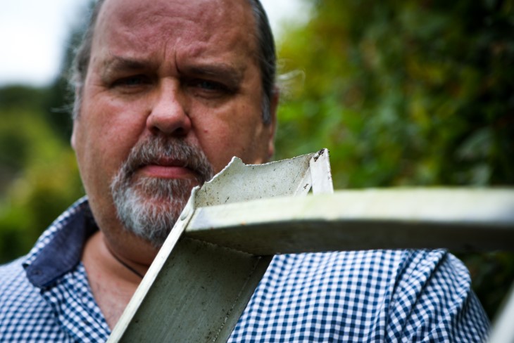 Martin Bosley looking at the broken ladder that caused his injury.