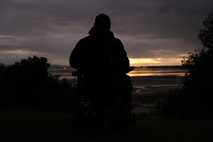 Lee looks out into the dusk sky