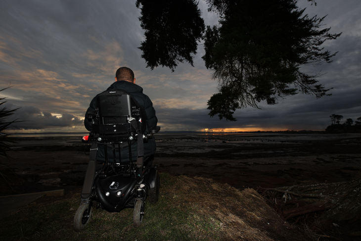 Lee looks out to the sky from his wheelchair