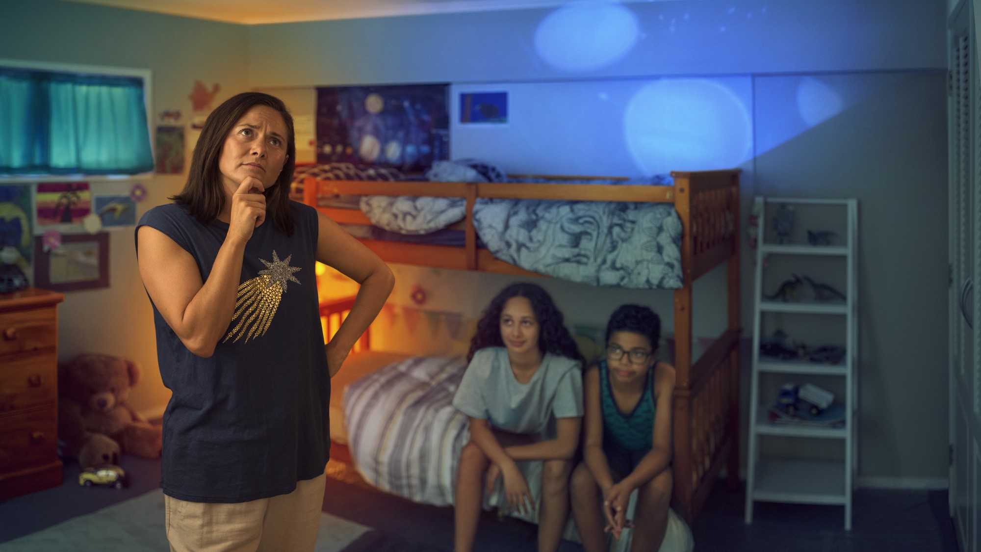 Mother thinking with kids sitting on bunk beds