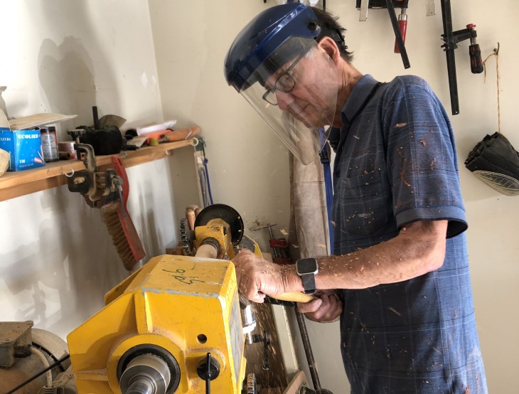 Trevor Markham turns wood on a lathe