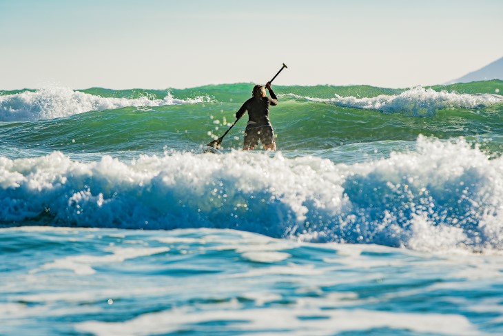 Verity goes out on her paddleboard in the waves