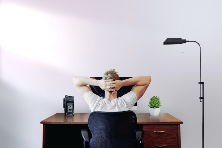 WFH man at desk Man works from home at his desk