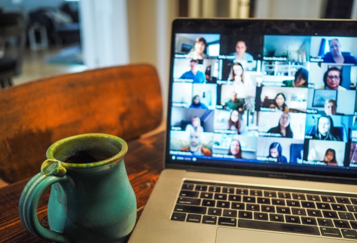 Image of a mug by a laptop on a zoom call