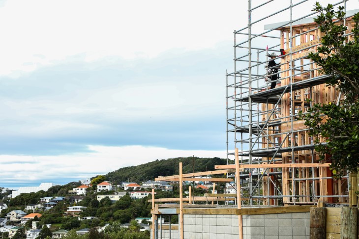 A house gets constructed with a view of Wellington in the background