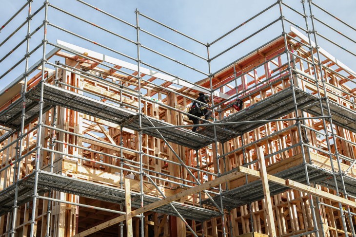 Construction site wrapped in scaffolding