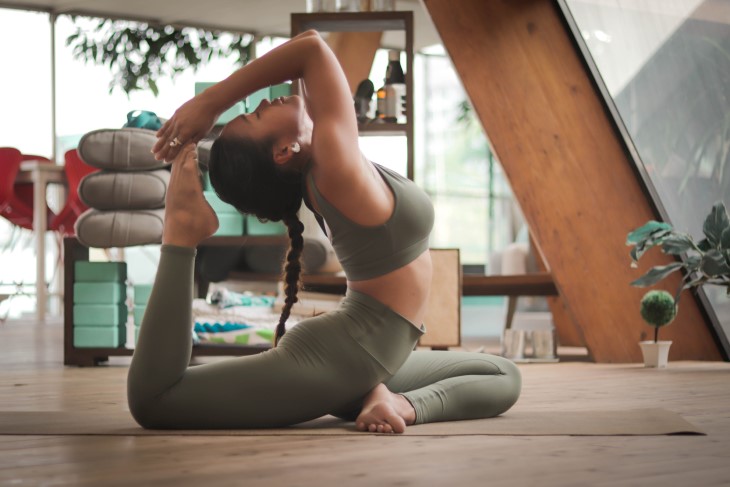 Woman does yoga at home