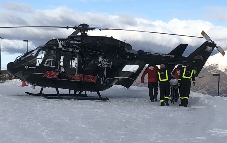 Carlton is loaded onto a rescue helicopter