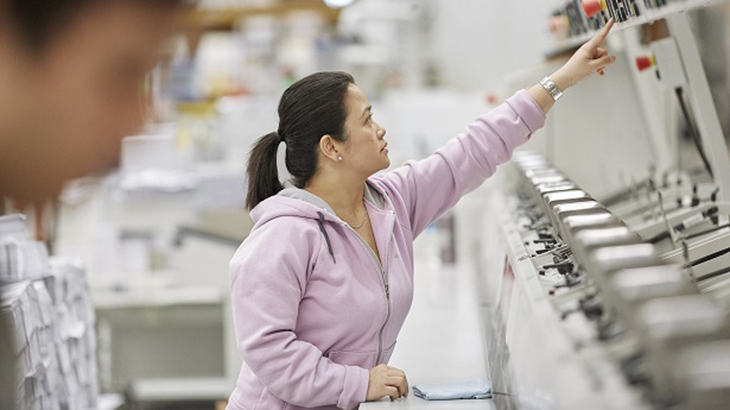 Woman operates machinery