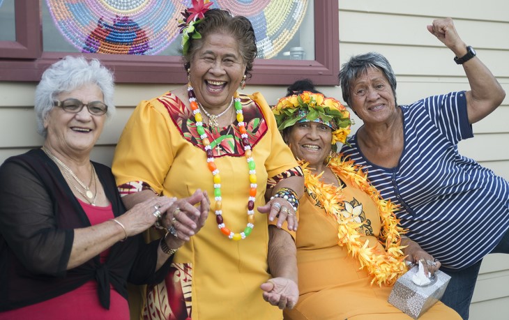 A group of Pacifica women sitting outside laughing