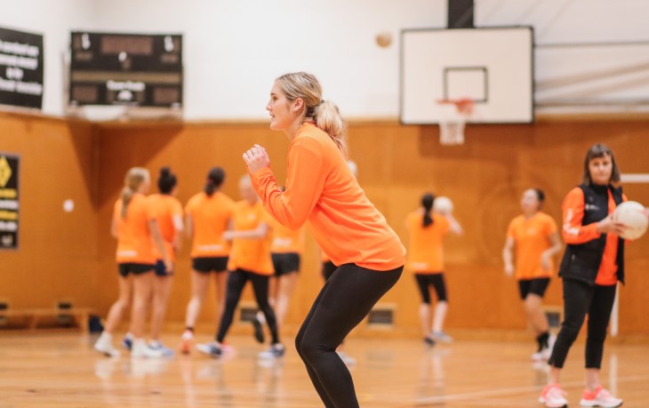 Maddy Gordon warms up at Netball