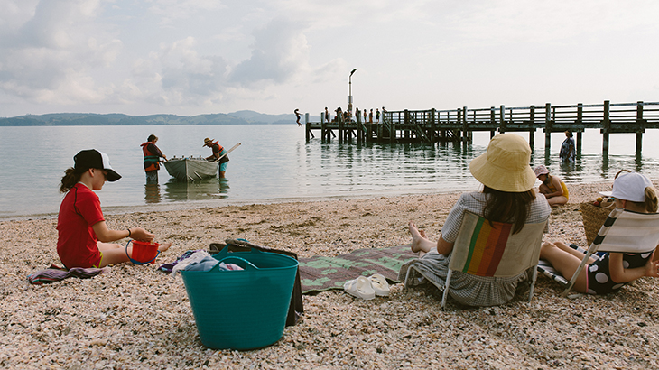 People sitting and enjoying the beach.