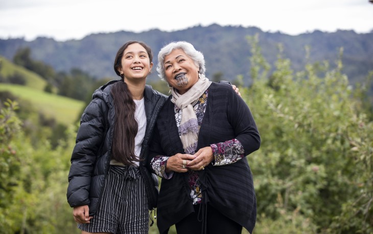 Grandparent with grandchild outdoors in nature