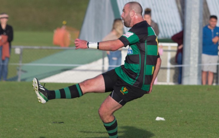Rhys Bennett kicking a rugby ball