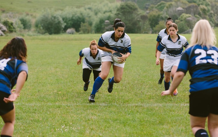 Woman's rugby team in play