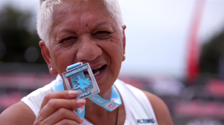 Waiora Rogers holds up her IronMāori medal