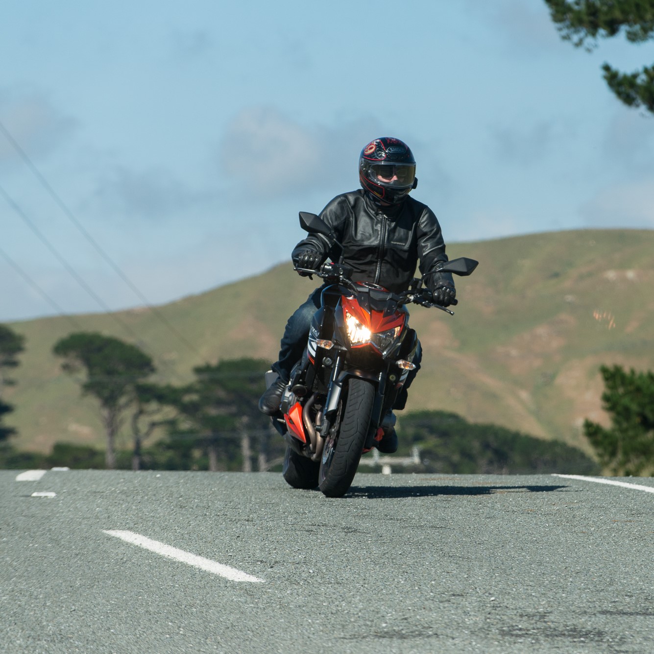 Motorcyclist riding on road
