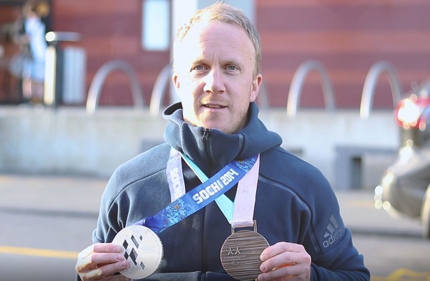 Corey Peters shows off his Olympic silver and bronze medals.