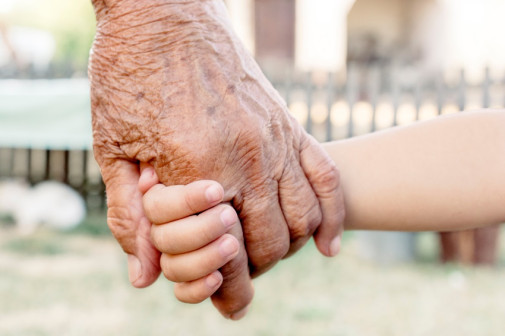 Grandparent and child holding hands