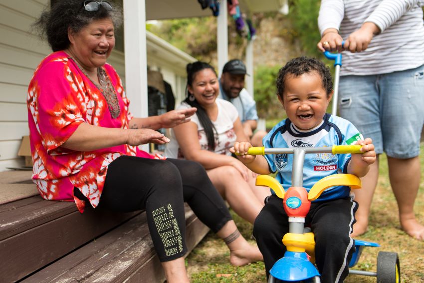 Pasifika family playing outdoors