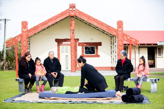 Maori tupuna performs rongoa Maori healing on a woman