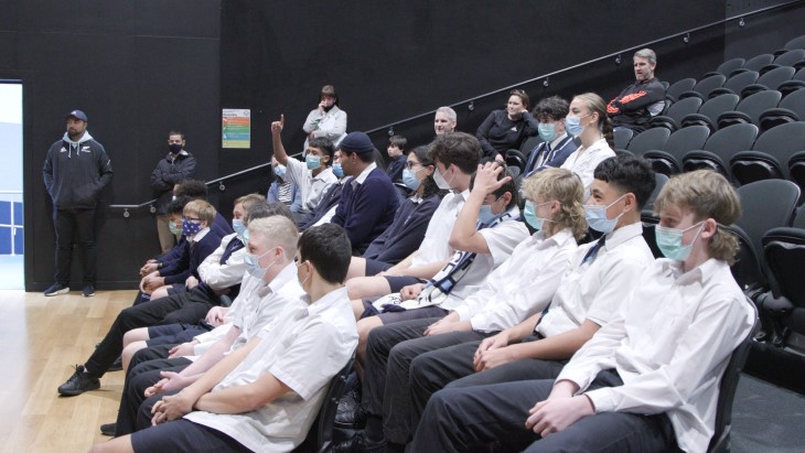 Aotea college students watch the All Blacks speak at their school