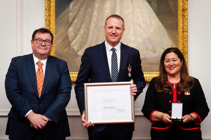 Andy Milne PSA Hero Andy Milne holds his award next to Deputy Prime Minister The Hon Grant Robertson, and Her Excellency