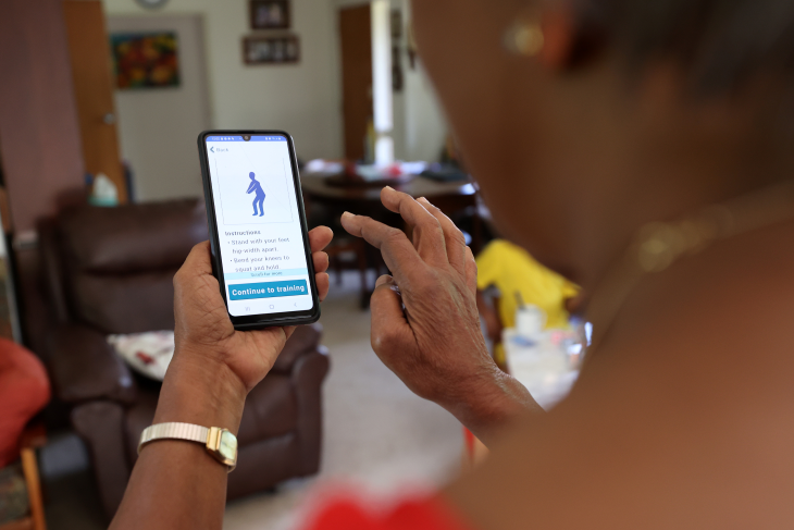 Dorothy Fitzpatrick using the Nymbl app on her phone. 