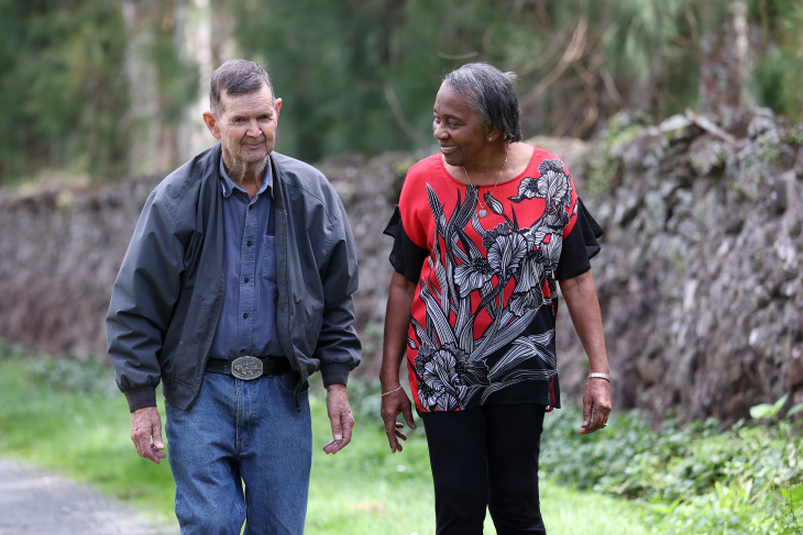 Dorothy and her partner walking on a path.