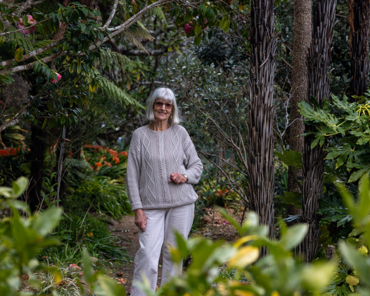 Gabrielle standing in her garden 