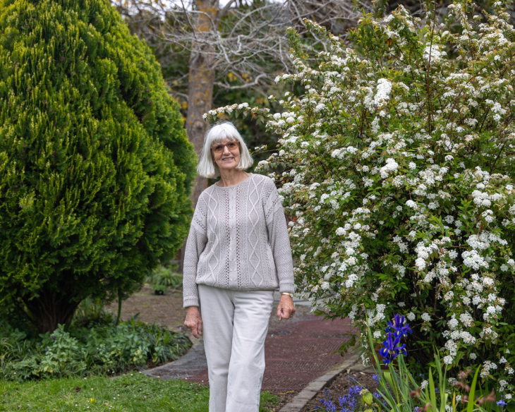 Gabrielle standing in her garden 