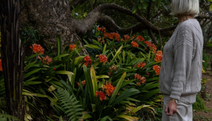 Woman standing by garden