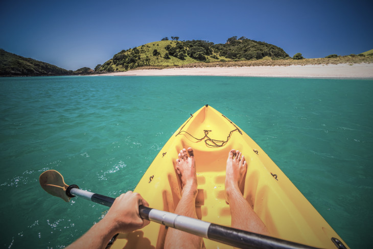 Paddling a kayak on the sea 