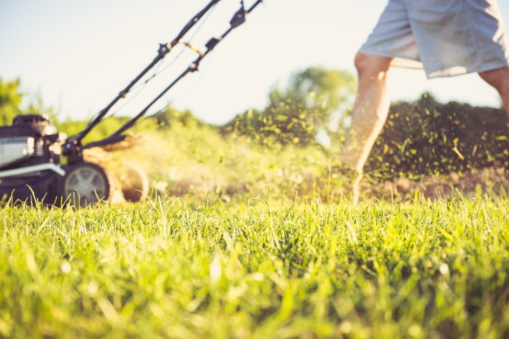 Person mowing grass.