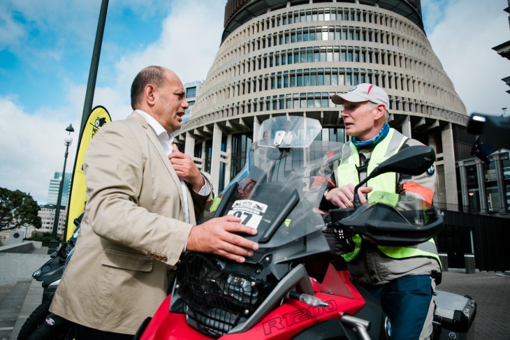 Minister Willie Jackson talks to a motorcyclists on their bike at the event