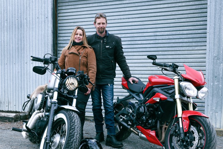 Mandy and her husband pose with their bikes