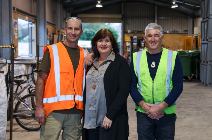 Michael stands with his recycling employers