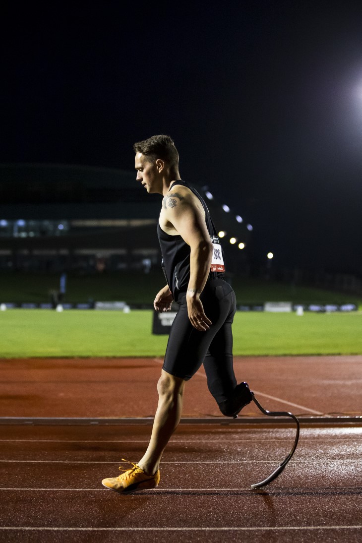 Mitch walking on the track in the evening.